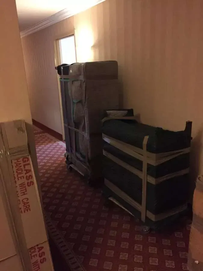 Furniture wrapped & dollied in the hallway